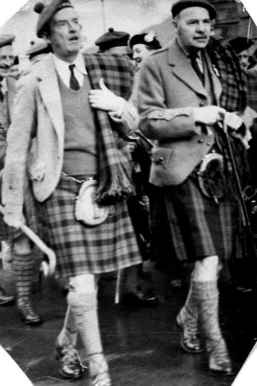 The image shows Ian Campbell, 11th Duke of Argyll (left) and his kinsman Angus Campbell, 20th Captain of Dunstaffnage, lead the procession to the Argyllshire Gathering, Oban, in September 1950.